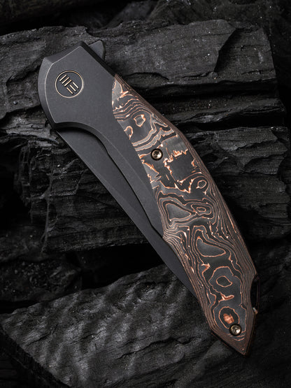 WE Merata Limited Edition 3.68" CPM 20CV Black Copper Foil Carbon Fiber Titanium Folding Knife by Anton Tkachenko WE22008B-1